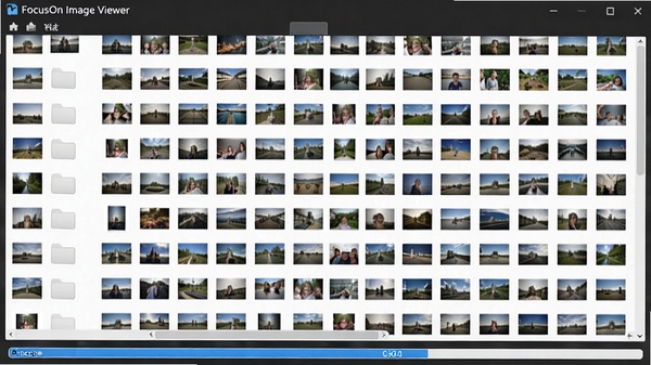 FocusOn Image Viewer 展示一个包含上千张图片的文件夹,缩略图快速加载,底部显示缓存进度条