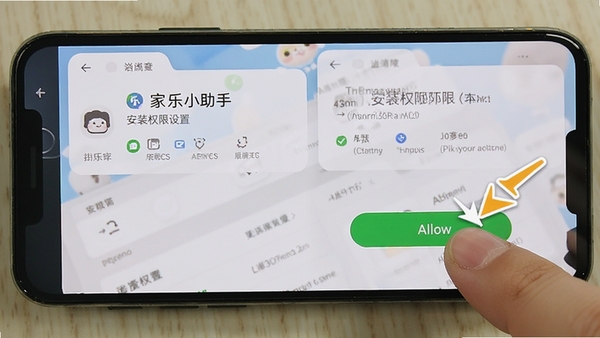 手机屏幕显示家乐小助手安装权限设置界面,手指正在点击允许按钮,背景为手机系统设置页面,画面清晰明亮,有箭头指示操作步骤